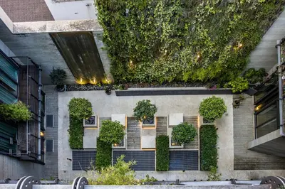 a building with a vertical garden on the side of it at Hella Urbana 152 in Rome