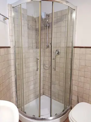 a shower stall in a bathroom with a toilet at èROMA - AVENTINO Apartment in Rome