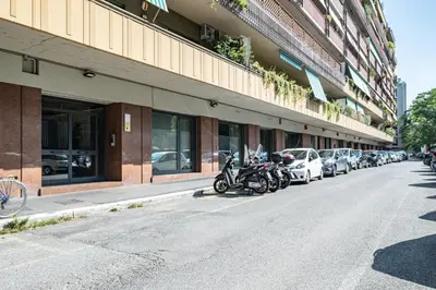 a row of motorcycles parked in front of a building at Caesar's Suite Trastevere in Rome