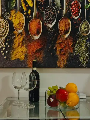 a table with two glasses and a bottle of wine at Suite Castelfidardo 50 in Rome