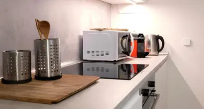a kitchen counter with various appliances on a counter top at Suite Castelfidardo 50 in Rome