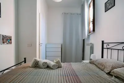 a bedroom with a bed with two pillows on it at La casa dell’attore - Roma Pigneto in Rome