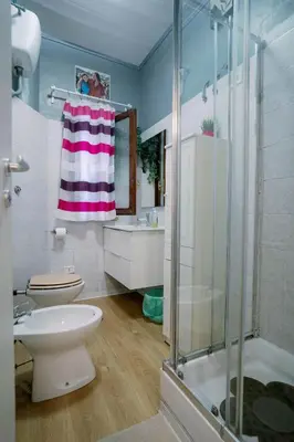 a bathroom with a shower and a toilet and a sink at La casa dell’attore - Roma Pigneto in Rome