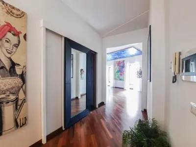 a hallway of a home with a painting on the wall at Navona Luxury Flat in Rome