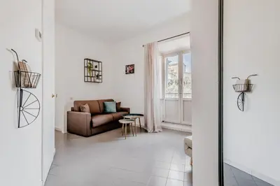 a living room with a couch and a table at Trastevere Holiday in Rome