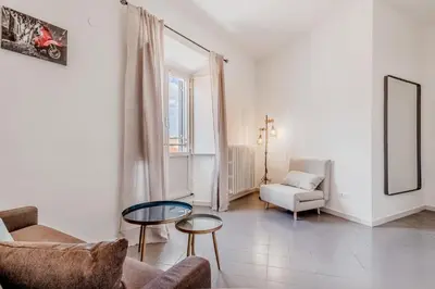a living room with a couch and a table at Trastevere Holiday in Rome