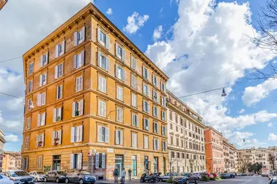 a large brick building on a city street at Trastevere Holiday in Rome