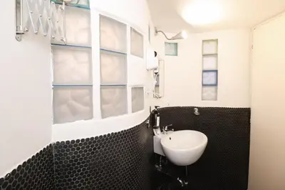 a room with a door with a bed and a door handle at HT RomeForAll in Rome