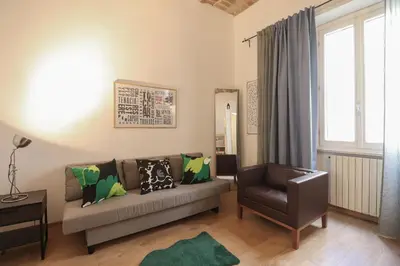 a bedroom with a bed with two towels on it at HT RomeForAll in Rome