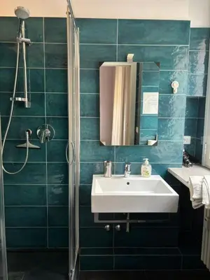 a bathroom with a sink and a mirror at Profumo di Sorrento a Roma in Rome