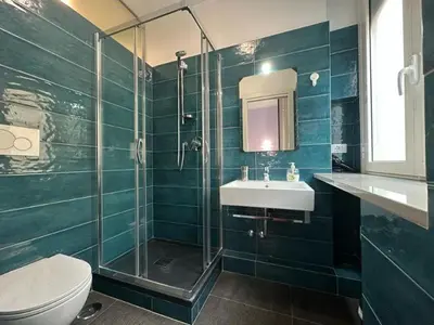 a bathroom with a shower and a sink and a toilet at Profumo di Sorrento a Roma in Rome