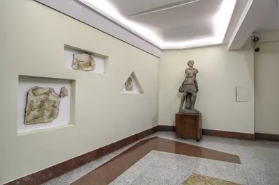 a room with a statue of a woman on a table at Roma Centro CDR Luxury Suites in Rome