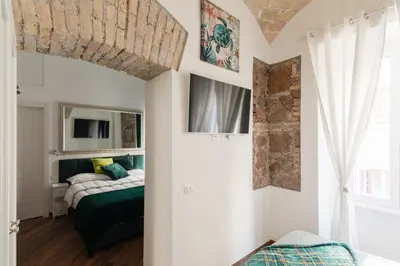 a bedroom with a bed and a window at Bretone XI b&b in Rome