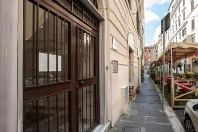 a narrow alley with a door on a building at Castro Pretorio Cozy apartment in Rome