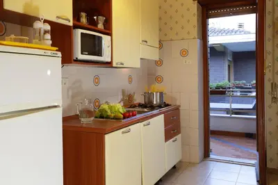 a kitchen with a counter with fruits and vegetables on it at Family Suite in Rome