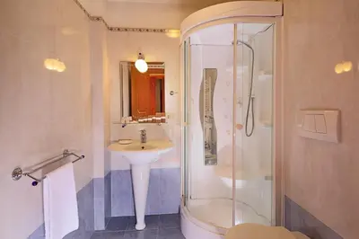a bathroom with a sink and a shower at Family Suite in Rome