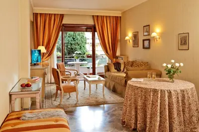 a living room with a couch and a table at Family Suite in Rome