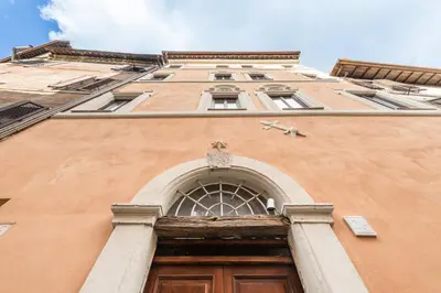a tall building with a door in front of it at La Gatta De Lisa in Rome