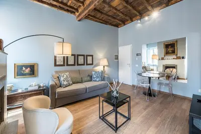 a living room with a couch and a table at La Gatta De Lisa in Rome