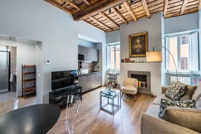 a living room with a couch and a fireplace at La Gatta De Lisa in Rome