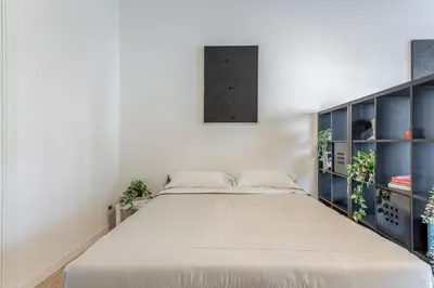 a bedroom with a large bed in a room at Family Art Flat in Rome