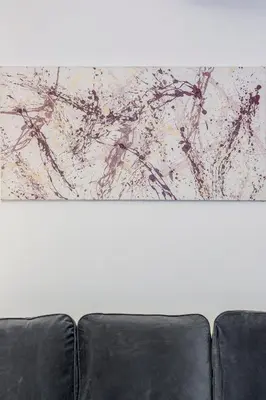 a painting on the back of a couch at Family Art Flat in Rome