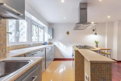 a kitchen with a sink and a counter top at Family Art Flat in Rome