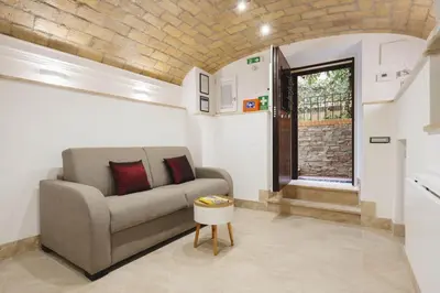 a living room with a couch and a window at Domus Mariani - Cremera by Ghor in Rome