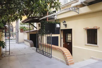 a building with a gate on the side of a street at Domus Mariani - Cremera by Ghor in Rome