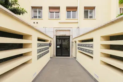 a hallway leading to a building with a door at LoveRhome Apartment 2 in Rome