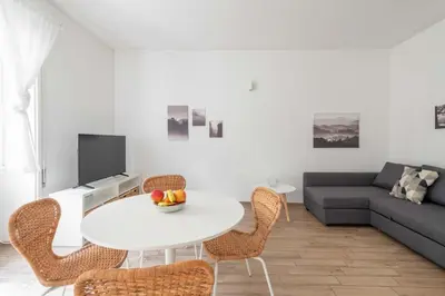 a living room with a white table and chairs at LoveRhome Apartment 2 in Rome