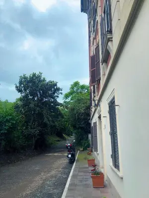 a motorcycle parked on the side of a building at Oasi San Pietro in Rome