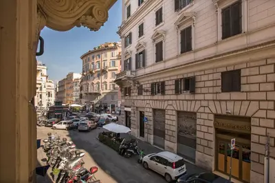 a view of a city street with parked motorcycles at Nettuno Apartment in Rome