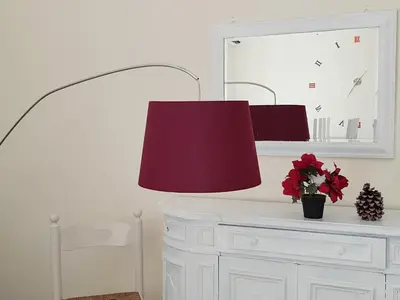 a red lamp sitting on top of a white desk at Casa de mi Zia in Rome
