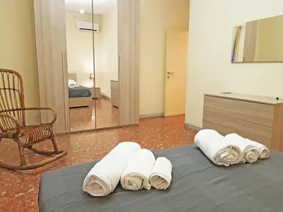 a room with four rolled towels on a bed at Casa de mi Zia in Rome