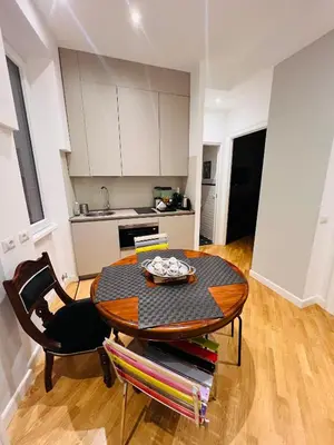 a kitchen with a table and a dining room at Suite21-Parioli in Rome