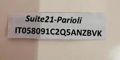 a sign is hanging on a wall with writing on it at Suite21-Parioli in Rome