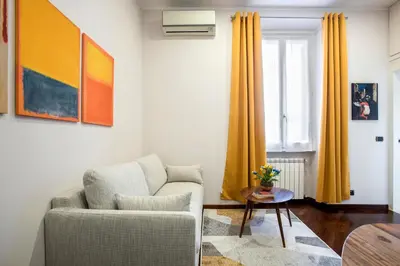 a living room with a couch and a chair at Montebello Style in Rome