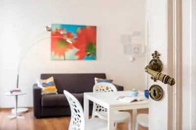 a living room with a table and a couch at Minerva 2 Apartment in Rome