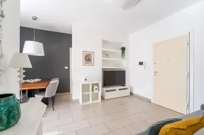 a living room with a couch and a table at Maison Lumiere, Design Apt 5 min from Tiburtina Station in Rome