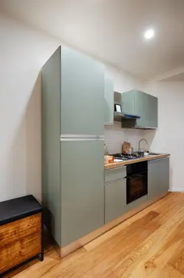 a kitchen with a refrigerator and a stove at Home Trastevere.62 in Rome
