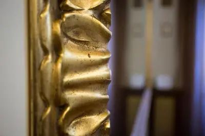 a close up of a gold handle on a door at Vatican Fabio Massimo Apartment - Stay Inn Rome Experience in Rome