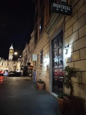a building with a sign on the side of it at B&B L'Esquilina in Rome