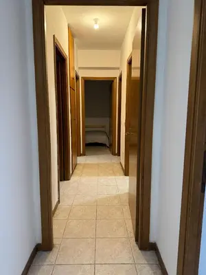 a hallway of a room with a bed in the distance at RAHIMA GUEST HOUSE in Rome