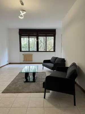 a living room with two couches and a glass table at RAHIMA GUEST HOUSE in Rome