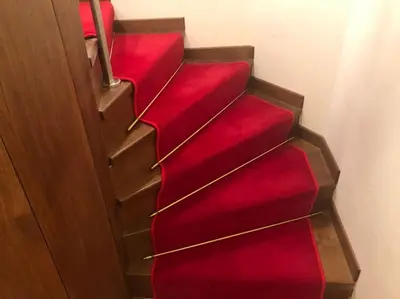 a group of red stairs in a room at Walking distance from Via Veneto in Rome
