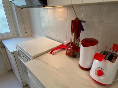 a kitchen counter top with a white appliance on it at Camilluccia Dream Apartment in Rome