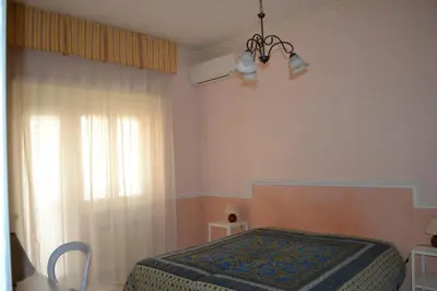 a bedroom with a bed and a window at Perla Vaticana in Rome