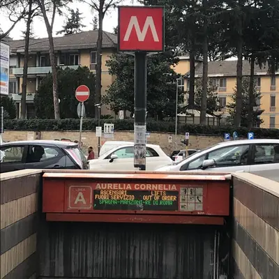 a sign on top of a bridge with cars at Perla Vaticana in Rome