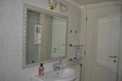 a bathroom with a sink and a mirror at Perla Vaticana in Rome